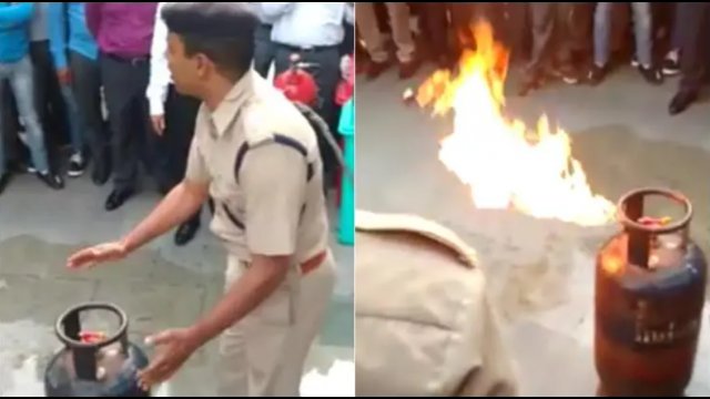 Hinduski policjant pokazuje jak zgasić płonącą butlę LPG [WIDEO]